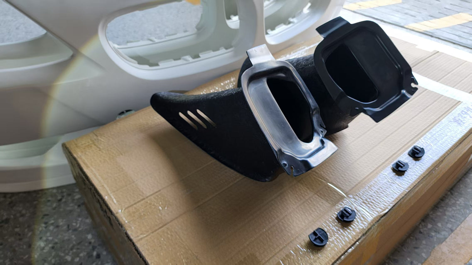 Close-up of Skyer BMW Z4 M-Style FRP brake cooling air duct, aftermarket reproduction for 2003-2008 Z4 Roadster and Coupe